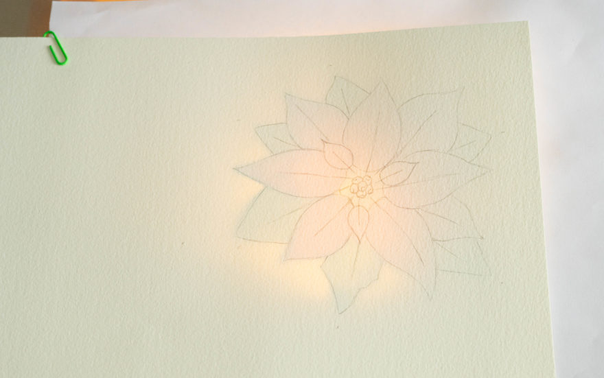 Christmas flower card design traced onto paper