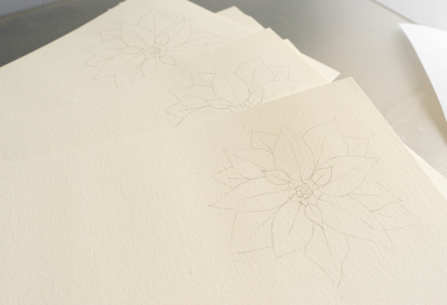 3 pieces of paper with the traced christmas flower card